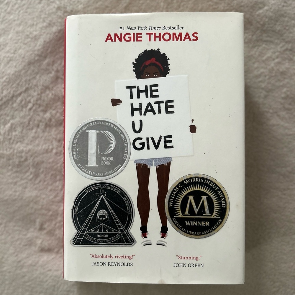 #1 New YorkTimes Bestseller• The Hate U Give by Angie Thomas